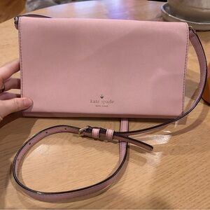 Light pink cross body bag with adjustable strap